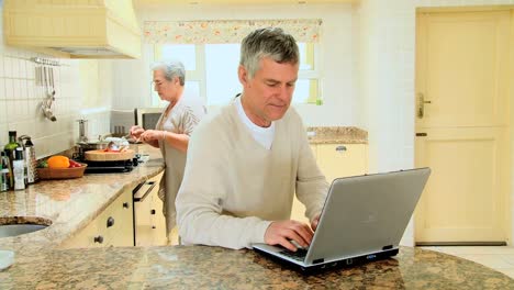 Mature-couple-in-kitchen