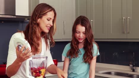Mother-and-daughter-making-smoothie
