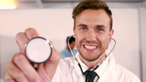 Portrait-of-a-doctor-holding-stethoscope