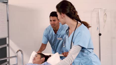 Focused-nurses-moving-a-patient