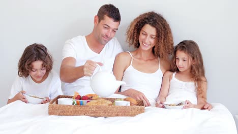 Happy-family-having-breakfast-