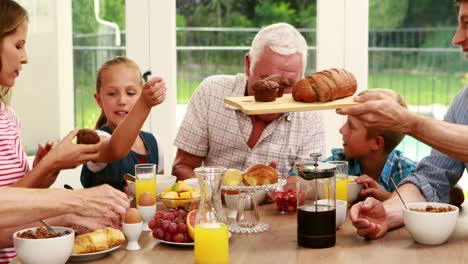 Happy-family-having-breakfast-together