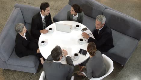 Business-people-sitting-in-circle