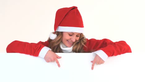 Young-blonde-woman-dressed-up-as-Santa-Claus