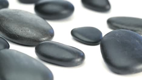 Several-black-pebbles-turning