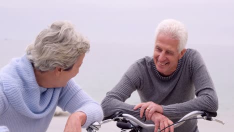 Retired-couple-laughing-with-bikes