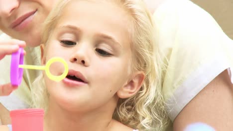 Little-girl-blowing-bubbles