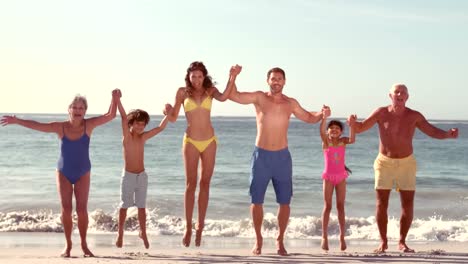 Happy-extended-family-jumping-with-hands-up