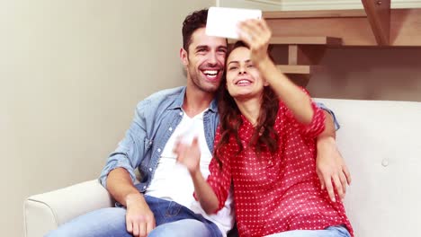 Happy-couple-taking-funny-selfie-