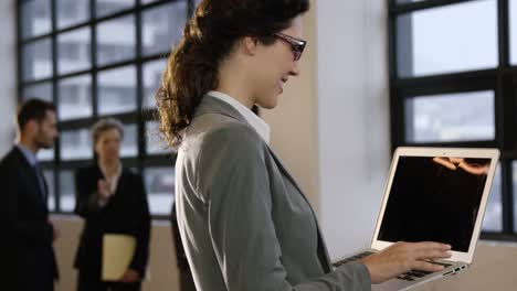 Businesswoman-using-her-laptop