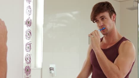 Handsome-man-brush-his-teeth
