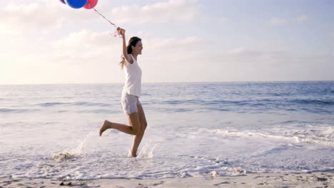 Happy-woman-holding-balloons