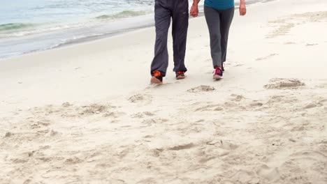 Couple-holding-hands-and-walking