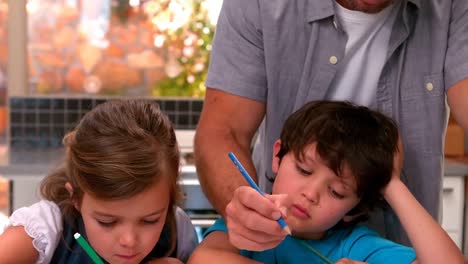 Father-and-children-drawing-together