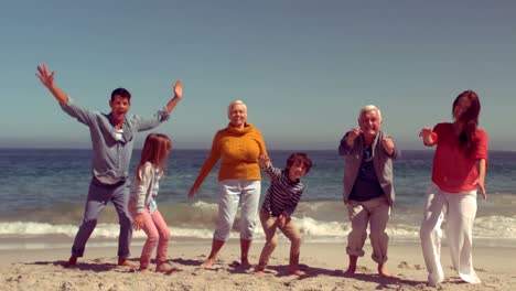 Happy-family-jumping-with-hands-up