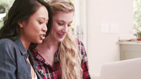 Two-female-friends-watching-laptop
