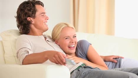 Cute-couple-watching-TV-