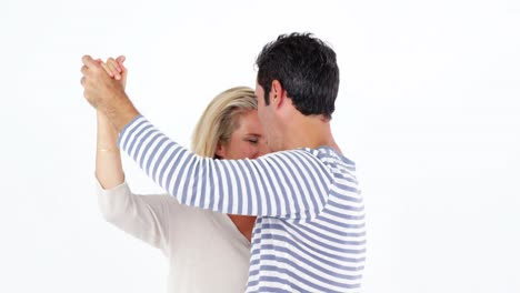 Mature-couple-dancing-against-white-background