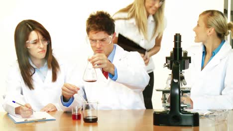 Scientists-working-in-a-laboratory-and-supervisor