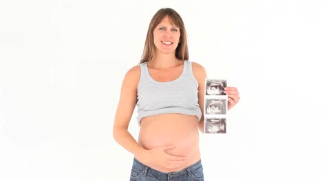 Mujer-Embarazada-Sosteniendo-Una-Exploración-De-Su-Bebé