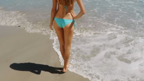Woman-standing-on-beach