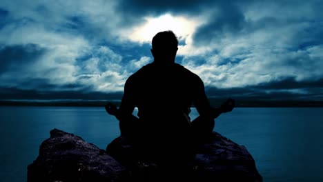 Man-meditating-at-Sunset