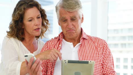 Mature-couple-is-looking-some-electronic-devices