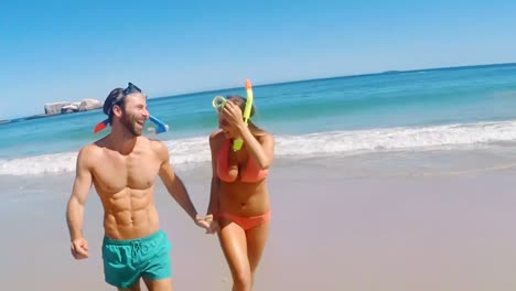 Couple-running-on-beach