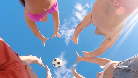 Group-of-friends-playing-with-football