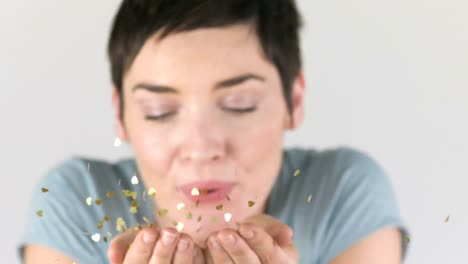 Woman-blowing-golden-sparkles-out-of-her-hands-in-Slow-motion