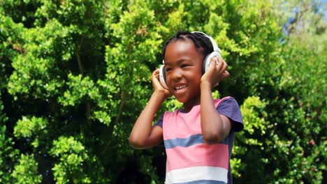 Little-boy-listening-music-with-his-headphones