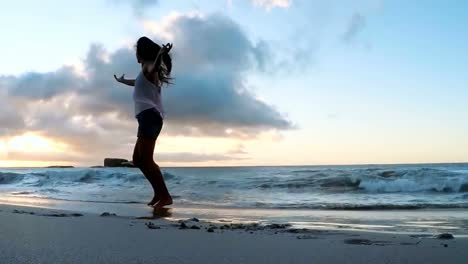 Woman-dancing-on-the-beach