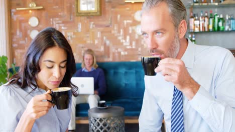 Woman-and-businessman-having-coffee