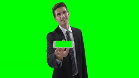 Businessman-showing-mobile-phone-on-a-virtual-touch-screen