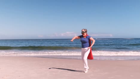 senior-woman-jumping-dressed-like-a-superheros