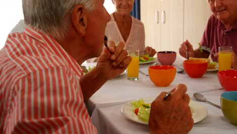 Senior-friends-having-meal
