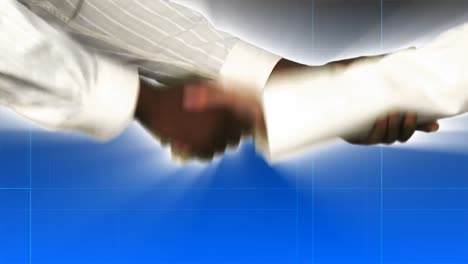 Close-up-of-businessman-and-businesswoman-shaking-hands
