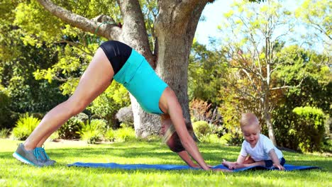 Woman-exercising-with-her-baby