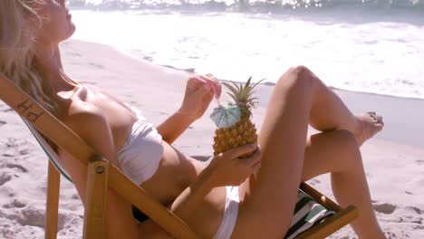 Woman-drinking-in-a-pineapple-