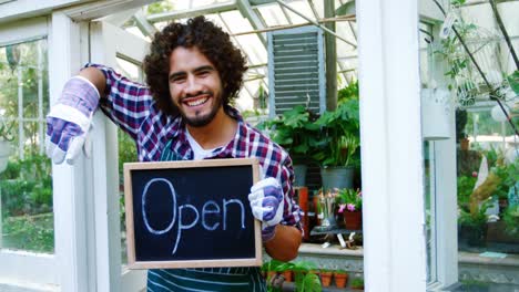 Happy-man-holding-open-sign