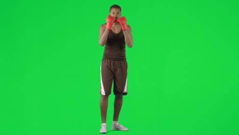 Hombre-Afroamericano-Boxeando-Contra-Imágenes-De-Pantalla-Verde