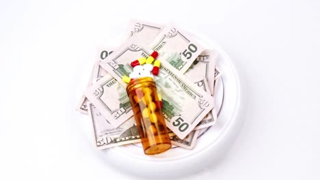 Dollars-and-pills-turning
