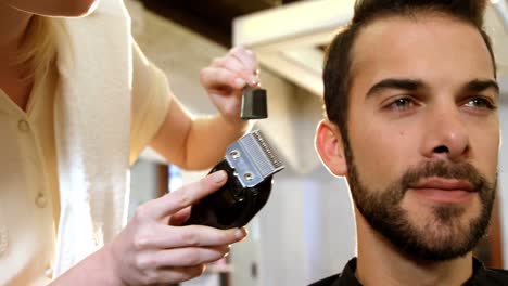 Man-getting-his-hair-trimmed-with-trimmer