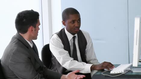 AfroAmerican-businessman-working-in-office-with-his-colleague