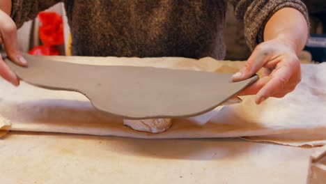 Potter-working-on-clay-sculpture