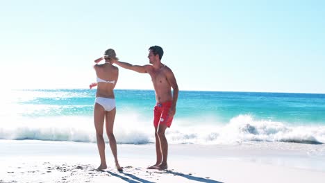 Couple-romancing-at-beach