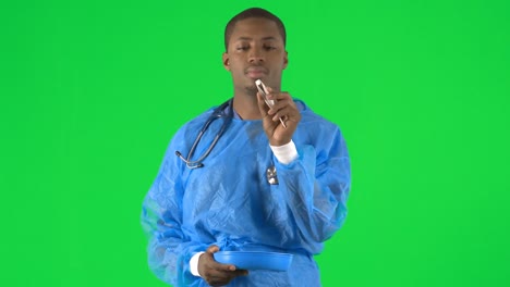 Footage-of-an-ethnic-male-surgeon-holding-a-pill-with-forceps