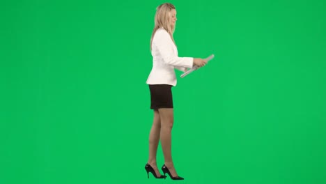 Businesswoman-working-with-a-laptop-against-green-screen-footage