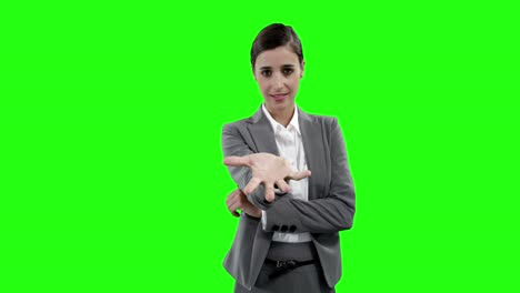Businesswoman-gesturing-against-green-screen