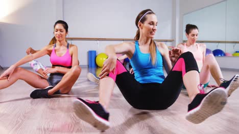 Group-of-women-performing-stretching-exercise